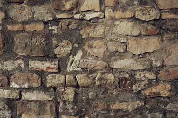 Stone background from the wall of an ancient building. Stone texture background