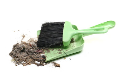 Green dustpan with bristle, broom sweeper with dirt isolated on white background, top view