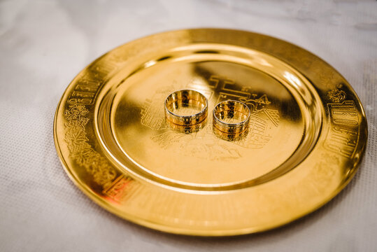 Photo of wedding rings in gold closeup.