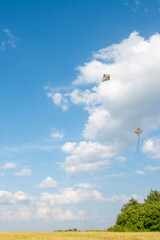 Fototapeta na wymiar wind kite flying in the blue summer sky