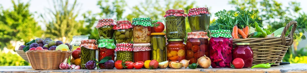 Jars with preserved vegetables for the winter. Selective focus. © yanadjan