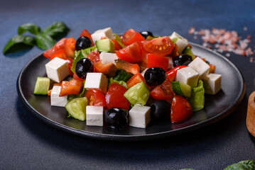 Greek salad with fresh vegetables, feta cheese and black olives