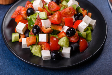 Greek salad with fresh vegetables, feta cheese and black olives