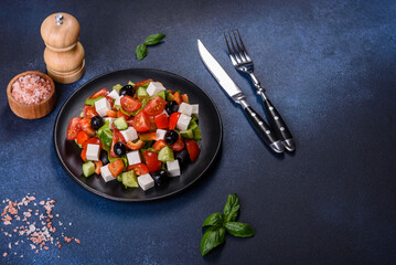 Greek salad with fresh vegetables, feta cheese and black olives