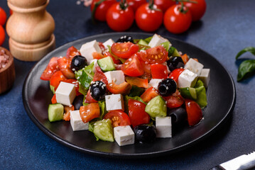 Greek salad with fresh vegetables, feta cheese and black olives