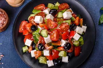 Greek salad with fresh vegetables, feta cheese and black olives
