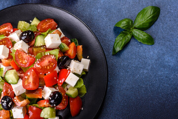 Greek salad with fresh vegetables, feta cheese and black olives