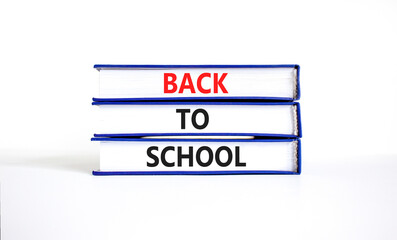 Back to school and support symbol. Concept words Back to school on books. Beautiful white table white background. Business, educational and Back to school quote concept. Copy space.