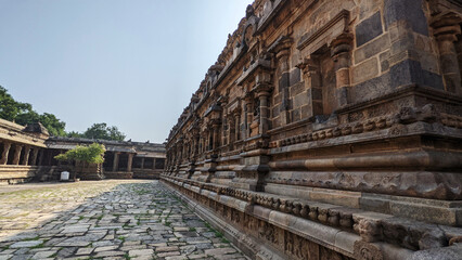 Fototapeta premium Up close to the temple walls filled with stone sculptures, Dharasuram, Tamil Nadu, India