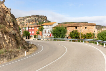 Fototapeta na wymiar a paved road entering Nuévalos town, province of Zaragoza, Aragon, Spain