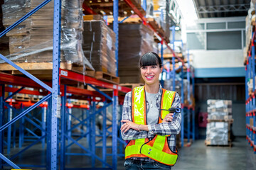 Young woman working in an industrial place of work. logistics service, warehouse management and inventory concept.