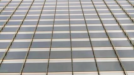 Panorama Tinted glass curtain wall of a building with vertical glass beams at Salt Lake City, Utah