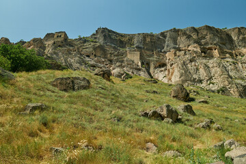 Fototapeta na wymiar Vardzia cave monastery site in southern Georgia excavated from the slopes of the Erusheti Mountain on the left bank of the Kura River daylight view