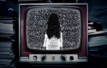 A television set in a room at night, showing static noise and a female ghost, a ghoulish girl with long hair. Horror themed scene.
