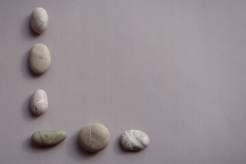 Abstract pattern of sea stones. Gray background with place for text.