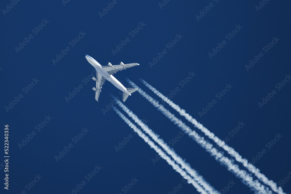 Wall mural airplane in the sky