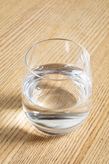 Glass of pure water on tablecloth