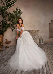 Fashion Beautiful Bride in wedding luxury dress with lace and crystals at arabian style interior....