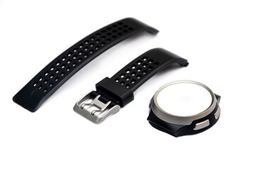 Diagonal view of black smartwatch broken into pieces on white isolated background