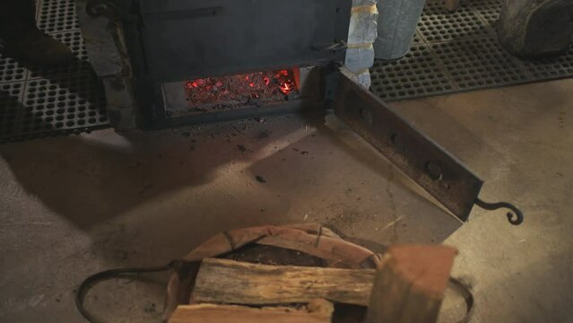 Sugar shack house with wood fire pan stove and iron kettle evaporator concentrating and evaporating for production of maple syrup in Highland country, Virginia
