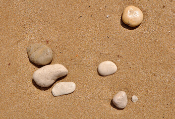 Fototapeta na wymiar Pebbles and beach sand