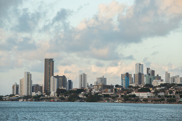 Obraz premium city skyline at sunset, street background, city skyline at sunset, urban coastal view, downtown cityscape panorama, modern buildings by sea
