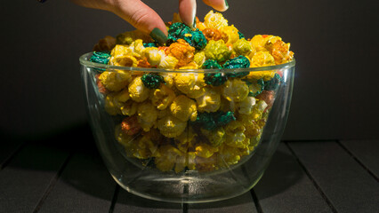 
colored popcorn on a black background