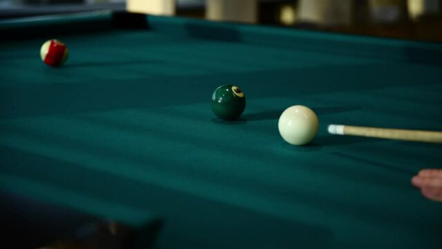Snooker player kicks the ball in pool billiard table with good and bad shots. Competition concept of different sports leisure activities games.
