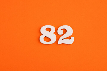 Number 82 - On orange foam rubber background