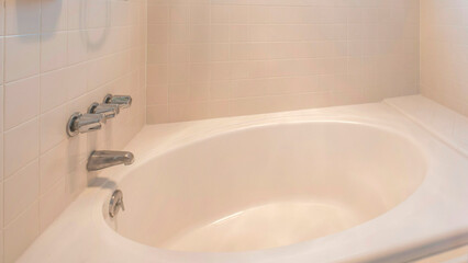 Panorama Sun flare Shower tub with beige tiles surround and wall-mounted dual shower heads and faucet