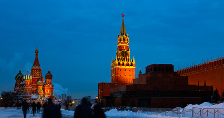 Evening St. Basil's Cathedral and the Spasskaya Tower of the Moscow Kremlin on Red Square in winter, Russia..
