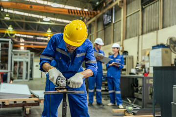 Asian attractive man industrial worker working in manufacturing plant. 