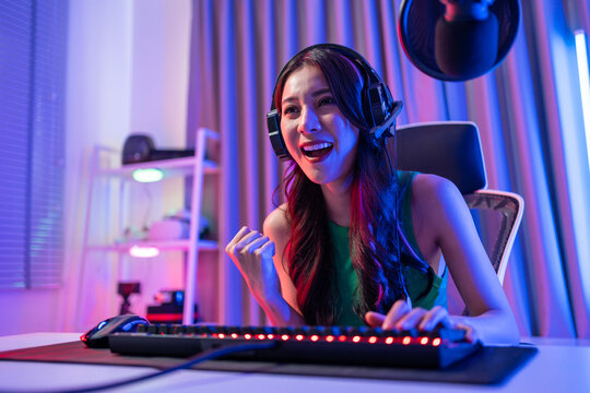 Asian Beautiful Esport Woman Gamer Play Online Video Game On Computer.