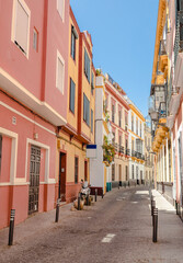 A colorful European street scene with nobody. Spanish architecture in the city of Seville.
