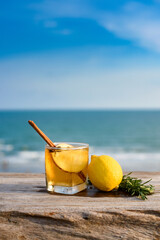 Refreshing cocktail on beach table.