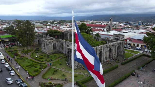 Beautiful aerial cinematic footage of the ruins, the CostaRican Flag, and the Bicentennial monument in Cartago Center  in Costa Rica