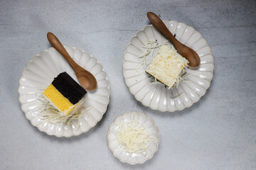 Two Layer Steam Cake or Brownies Kukus, top layer is cheese cake with shredded cheese and the bottom is chocolate brownies. 