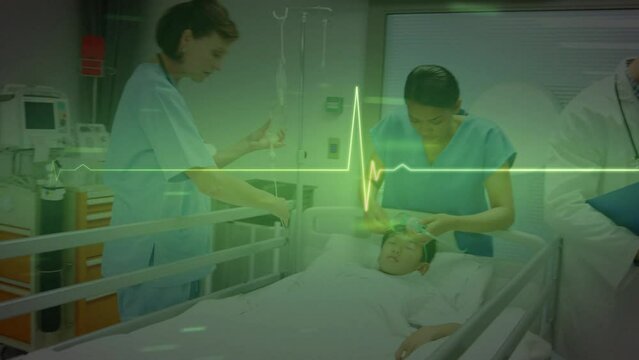 Animation of heart rate monitor over female health workers and asian boy at hospital