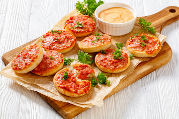 mini pizzas with ham and pecorino cheese, top view