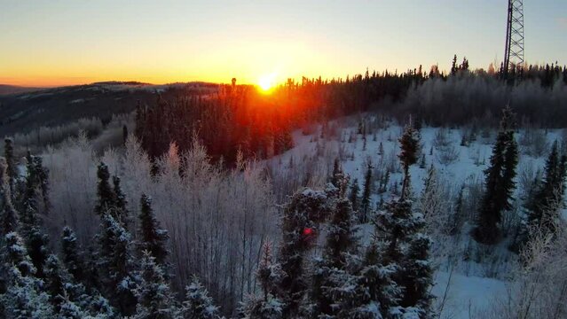 Aerial Forward Scenic Shot Of Frozen Trees On Hills, Drone Flying Forward During Sunset -  Fairbanks, Alaska