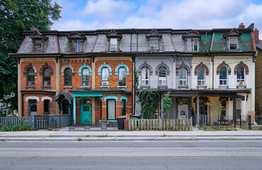 Original 19th century row houses with mansard roof - 522385360