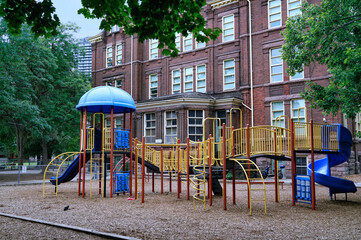 Fototapeta na wymiar School playground equipment and wood chips on the ground for safety