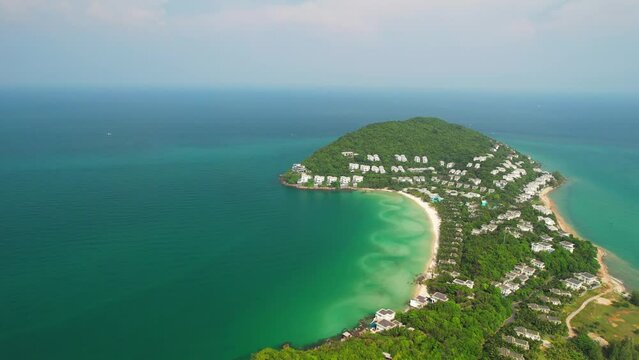 Small tropical island in the ocean with many resorts, aerial view of Ong Doi island in Phu Quoc, Kien Giang, Vietnam