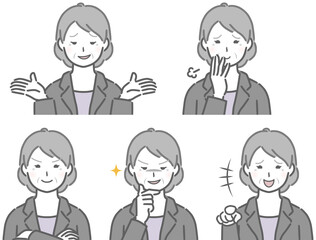 嫌な表情のスーツの高齢女性