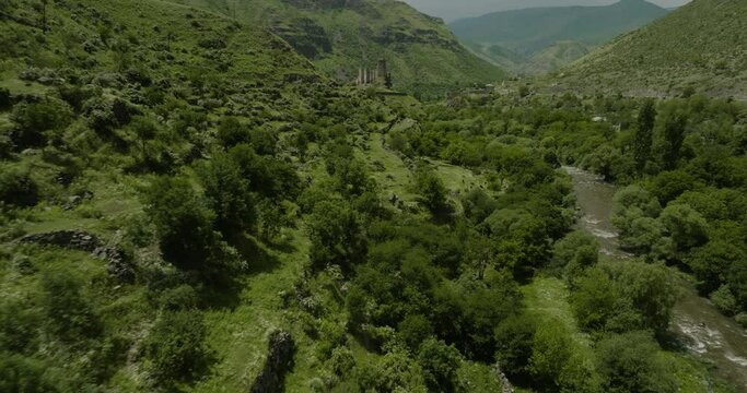 Prehistoric Traditional Terrace Farming By Georgians With Grazing Domestic Animals Alongside Paravani River Overlooking The Classic Khertvisi Fortress In Georgia. Drone Shot