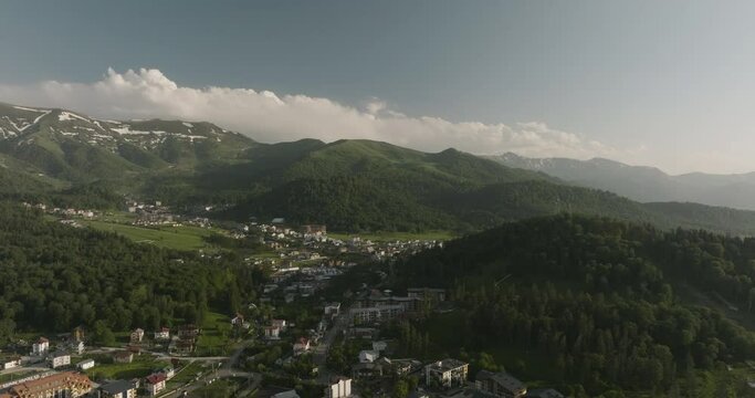 Hotel Accommodation And Lodges With Dense Mountains At Bakuriani Ski Resort Town In Georgia. Aerial Wide Shot