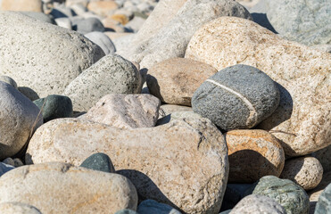 gray stone with white stripe between white stones