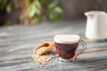 Cup with coffee barley with barley grains. Healthy herbal drink for immunity. Coffee alternatives