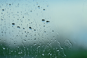Rain drops on window in a close up