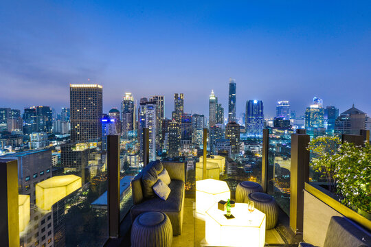 Bangkok City View Point From Rooftop Bar, Overlooking A Magnificent Cityscape Blue Sky And City Light, Thailand	